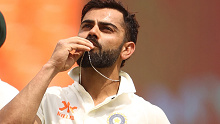 AHMEDABAD, INDIA - MARCH 12: Virat Kohli of India celebrates after scoring his century during day four of the Fourth Test match in the series between India and Australia at Narendra Modi Stadium on March 12, 2023 in Ahmedabad, India. (Photo by Robert Cianflone/Getty Images)