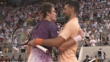 Novak Djokovic and the teen embrace.