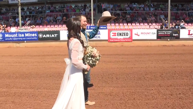 Couple get married at Mt Isa Rodeo.