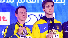 (L-R) Silver Medalist, Cameron McEvoy of Team Australia, Gold Medalist, Vladyslav Bukhov of Team Ukraine and Bronze Medalist, Benjamin Proud of Team Great Britain pose with their medals during the Medal Ceremony after the Men's 50m Freestyle Final on day sixteen of the Doha 2024 World Aquatics Championships at Aspire Dome on February 17, 2024 in Doha, Qatar. (Photo by Adam Nurkiewicz/Getty Images)
