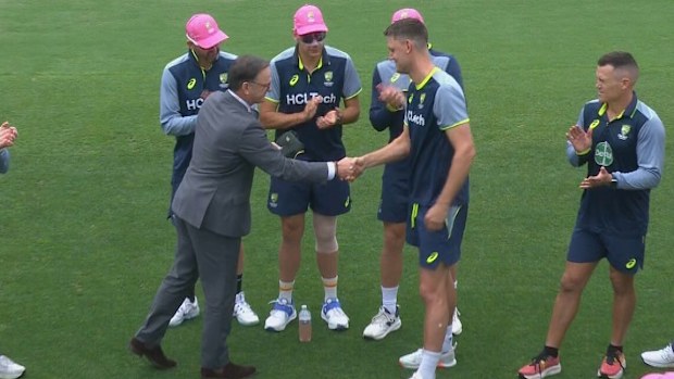 Mark Waugh presents Beau Webster his baggy green.