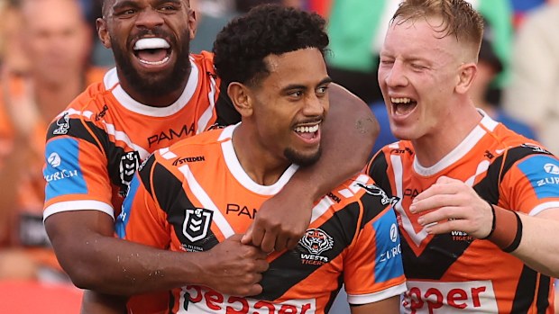 Jahream Bula of the Tigers celebrates a try.