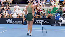 Paula Badosa throws her racquet. 