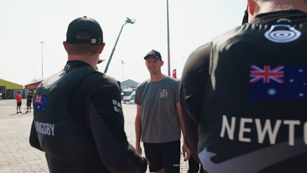 Kyle Langford (centre) talks to his former Australia teammate Tom Slingsby after defecting to Italy.