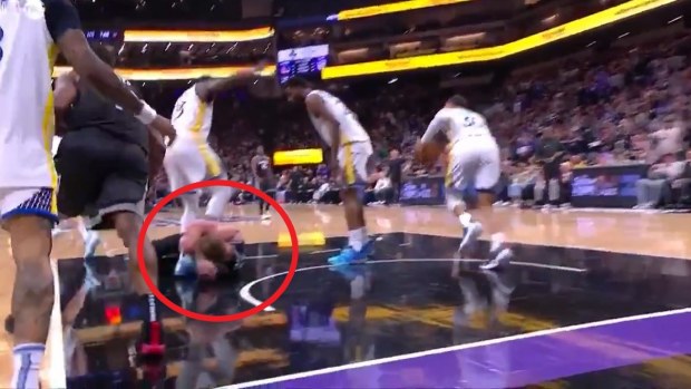 Draymond Green stomps on Sacramento's Domantas Sabonis.
