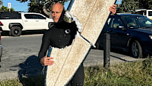 NOTE SWEARING IN PIC The shark took a large bite out of the surfer's board at Cabarita.
