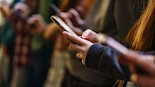 Close-up of mobile phones in children's hands in the school