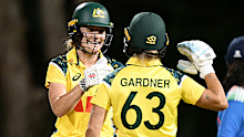 Annabel Sutherland and Ashleigh Gardner of Australia celebrate victory.