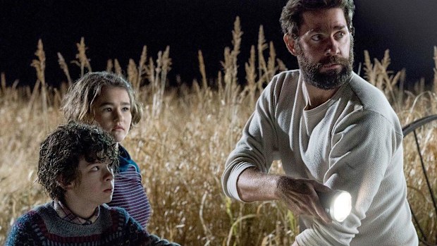 Noah Jupe, Millicent Simmonds and John Krasinski in A Quiet Place