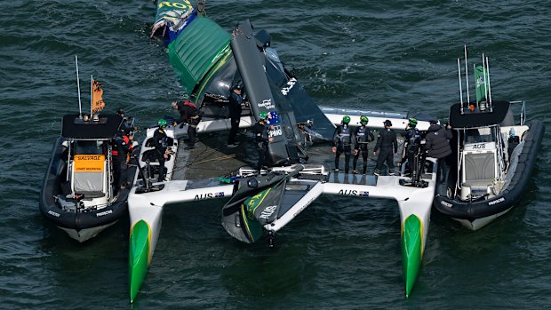 Australia SailGP Team helmed by Tom Slingsby are attended to by their support boat after the main wing broke during racing on Race Day 2 of the Oracle San Francisco Sail Grand Prix.