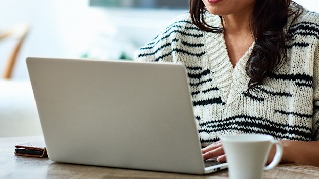 Woman using computer at home