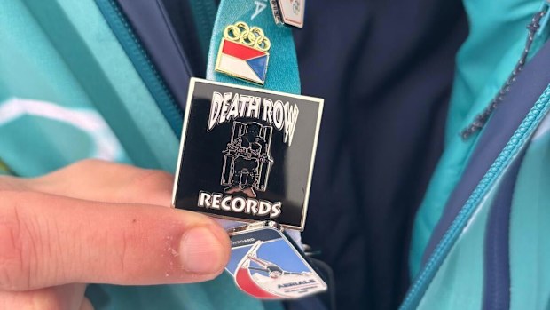 An Italian security guard shows off his Death Row Records pin.