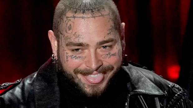 Post Malone accepts the top artist award at the Billboard Music Awards on Wednesday, Oct. 14, 2020, at the Dolby Theatre in Los Angeles. (AP Photo/Chris Pizzello)