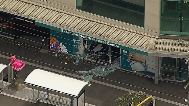 A pedestrian has been killed and a woman injured after a car crashed through a medical centre in Melbourne's north-west, ending up 30m from the road.