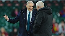 Australia coach Joe Schmidt chats to Wales coach Warren Gatland.