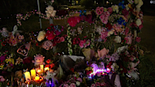 The mood has since been peaceful and ﻿quiet in Alice Springs as the community wraps its arms around ﻿Kumanjayi Little Baby's family.A large floral tribute has grown in the town with bouquets ﻿of flowers, candles and soft toys.