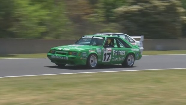 Jett Johnson at the wheel of his grandfather Dick Johnson's 1985 Greens-Tuf Mustang during a legend's parade ahead of the Bathurst 1000.