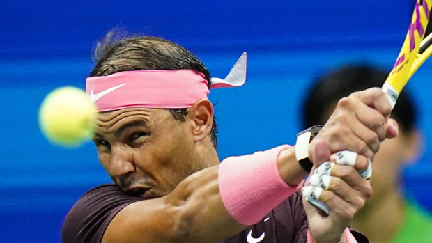 Rafael Nadal of Spain returns a shot to Fabio Fognini of Italy.