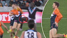Toby Greene cops Aliir Aliir's knee to his hip. 
