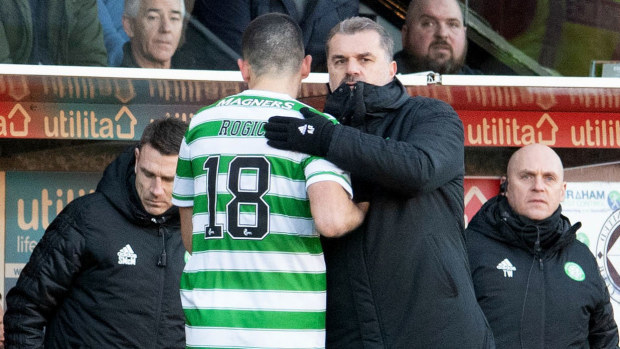 Ange Postecoglou congratulates Tom Rogic after substituting the Celtic star.