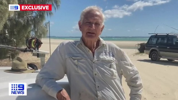 A retiree has been forced to wade into the water to dodge a pack of dingoes on the Queensland island of K'gari, formerly known as Fraser Island.Fisherman David Prain, 74, was forced into waist-deep water amid a stand-off with four of the animals.