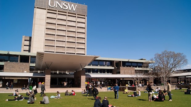 "Sydney, Australia - August 17, 2012: Students and graduates converge on a lawn before the University of New South Wales (UNSW) library on a clear winter morning."