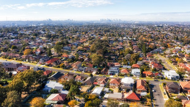 City of Ryde residential suburbs of Greater Sydney in Australia - aerial view towards distant city CBD on horizon.