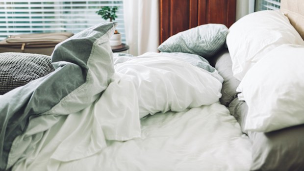 Comfortable bed has been slept in.