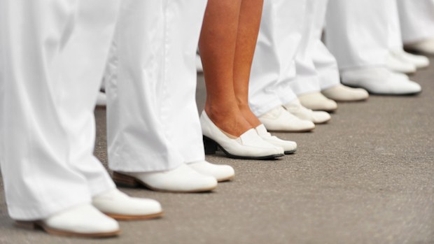 Navy officers stand in formation for Navy's Day Parade.