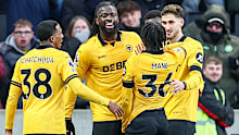 Wolves players celebrate a goal.
