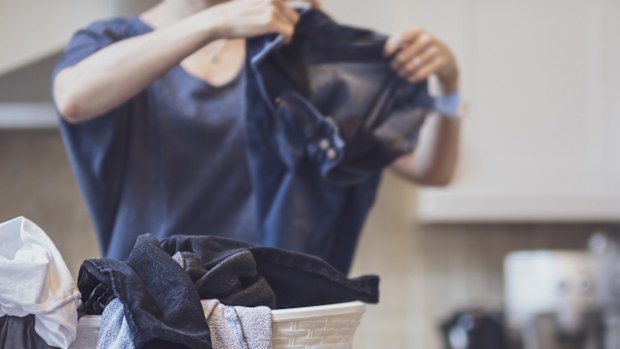 woman folding laundry