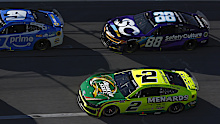 Austin Cindric, driver of the #2 Ford and Shane Van Gisbergen, driver of the #88 Chevrolet, race during the NASCAR Cup Series.