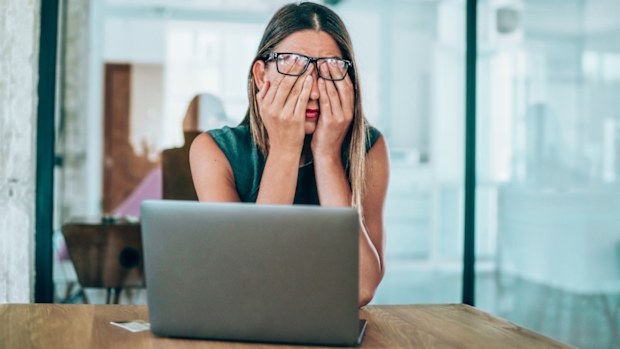 Woman stressed at work.