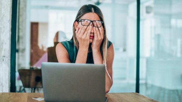 Woman stressed at work.