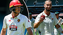 Nathan McSweeney departs while Kieran Elliott celebrates his six-wicket haul. 