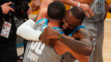 Steph Curry and LeBron James embrace after the All Star Game.