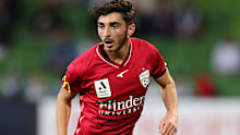 Josh Cavallo in action for Adelaide against Melbourne Victory on Saturday. 