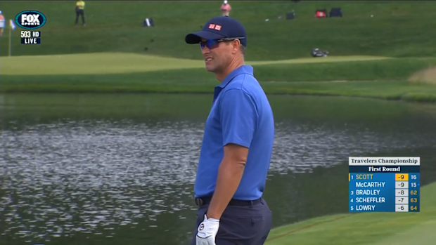 Australian golfer Adam Scott reacts after finding water during the Travelers Championship.