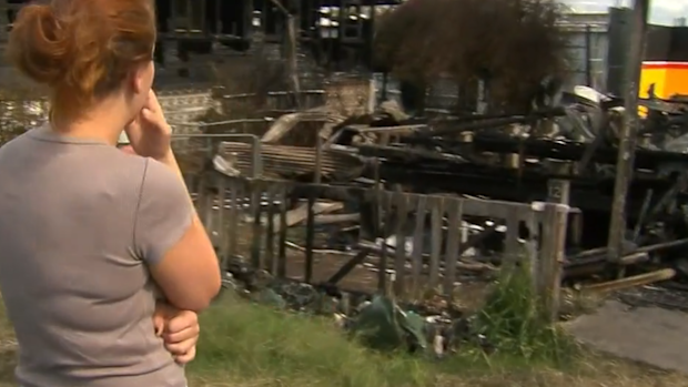 The partner of one resident surveying the inferno's damage.