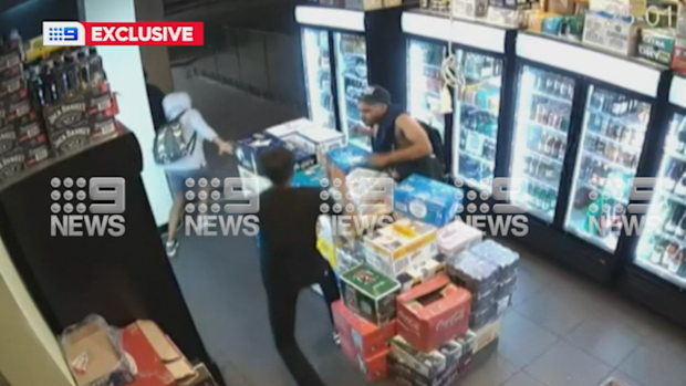 Violent thieves threw chairs at and punched bottleshop owners after they tried to defend their store, in footage revealed by 9News. 