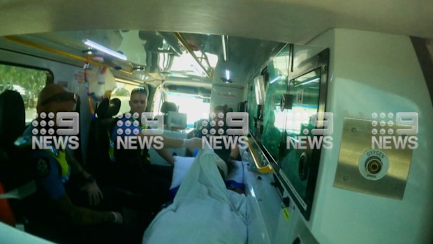 A man arrested by police over missing Cleo Smith being taken to hospital in an ambulance.