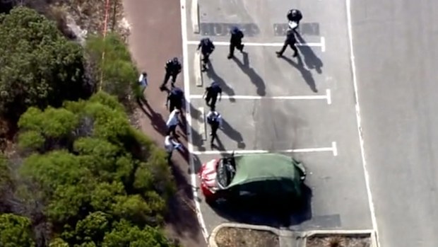 Firefighters have found three bodies inside a burnt out vehicle at a car park in Perth.