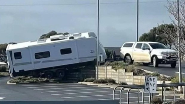 This driver wasn't a happy camper, after getting his caravan became stuck in a shopping centre car park in Adelaide.