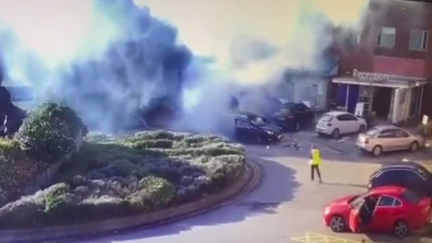 The driver managed to escape as others rushed to his aid.