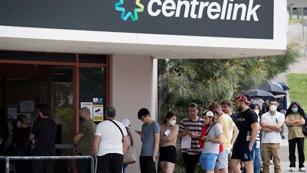 Newly unemployed Sydneysiders queue up outside a Centrelink in Rockdale. (Janie Barrett/The Sydney Morning Herald)