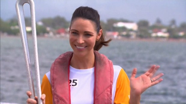 Giann Rooney with the Queen's Baton. (9NEWS)
