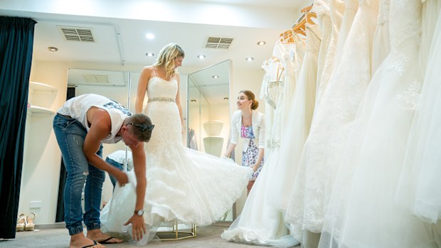 With some help, this bride tackles the tulle.