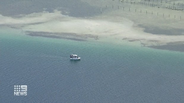 Queensland rangers are hunting for a three-metre crocodile on Minjerribah (North Stradbroke Island) after a reported sighting and have issued a warning to tourists and residents on the island.