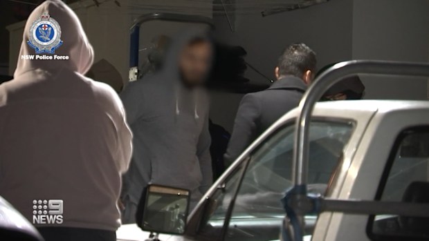 Two men have been charged and police are searching for three more after a woman was allegedly gang-raped in her home in Sydney's south-west.