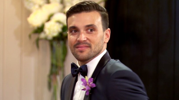 Michael turns to meet his new bride. 